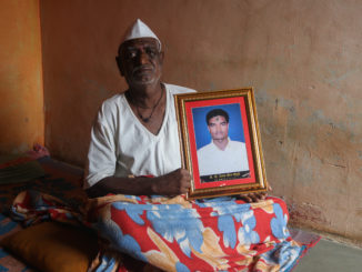 Shrirang Chougule, holding his son’s photo: “Even today, I can’t believe my son who was so strong and gave all of us hope died by suicide.” / credit: Sanket Jain