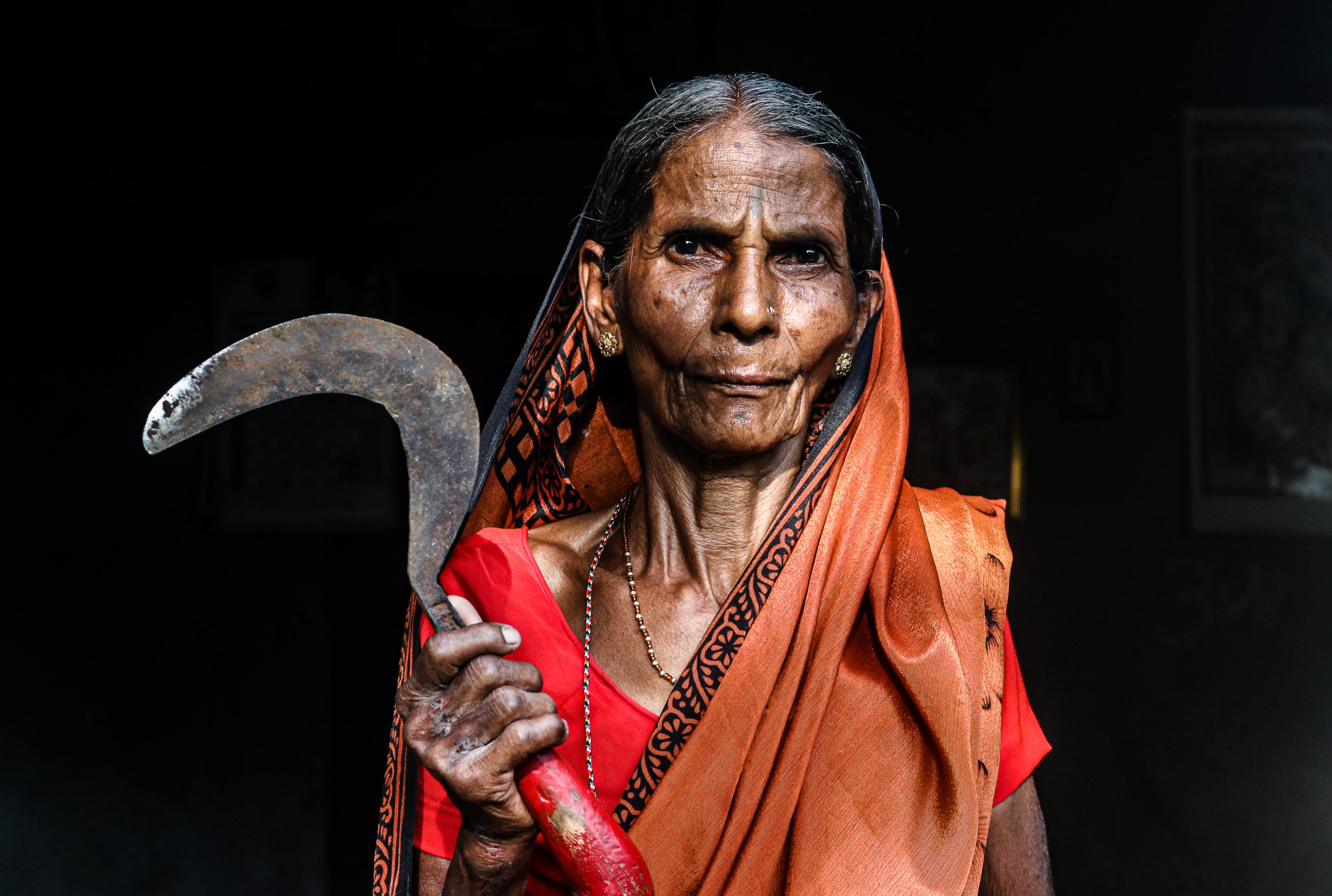 Vimal Ugale, in her 70s, does farm work to make ends meet. “Even today, I don’t know why my son thought of suicide.” / credit: Sanket Jain