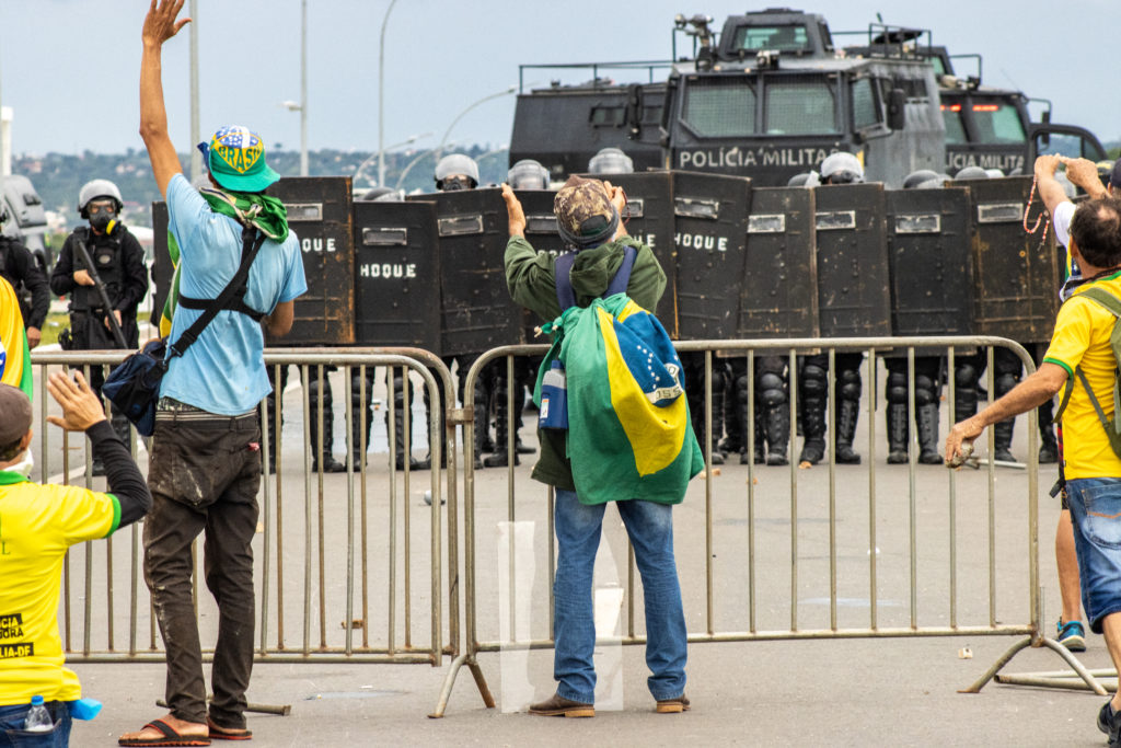 Riot police obstruct former Brazilian President Jair Bolsonaro’s supporters from heading toward the Planalto Presidential Palace in Brasilia on January 8. Two hours earlier, they managed to break into the National Congress, where a small police force was present, and which President Luiz Inácio "Lula" da Silva raised concern about. Right-wing extremists broke into government buildings, looting and vandalizing public property. A couple of hours later, the federal police seized control of the areas, arresting more than 1,500 people. Three days later, 599 were released, while the rest remain under investigation / credit: Antonio Cascio