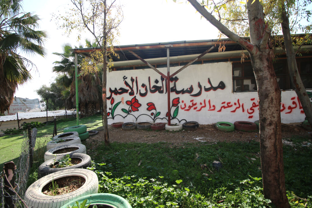 The entrance to the Khan al-Ahmar school in the West Bank, which reads "Khan al-Ahmar School" in Arabic / credit: Ahmad Al-Bazz