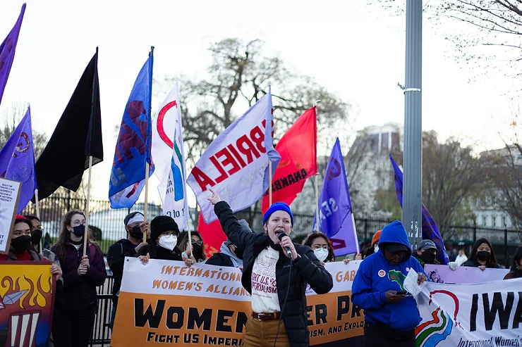 Katie Comfort of International Women’s Alliance spoke on March 4 in front of the White House, calling on organizations to join IWA and the anti-imperialist women’s movement / credit: Hannah Ballesteros