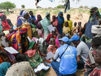 United Nations High Commissioner on Refugees staff with refugees from Sudan in Chad / credit: UNHCR/Colin Delfosse
