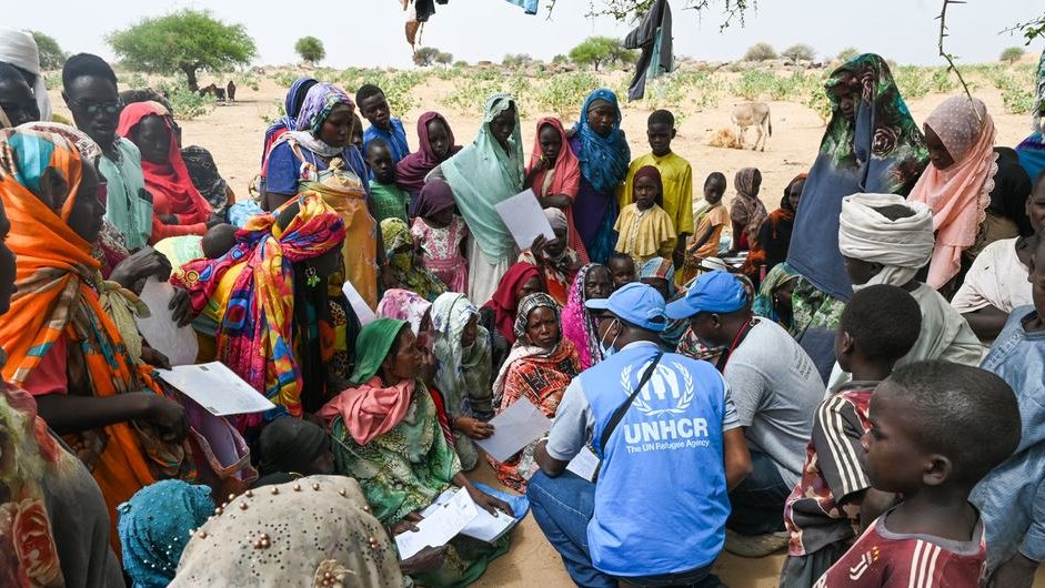 United Nations High Commissioner for Refugees staff with refugees from Sudan in Chad / credit: UNHCR/Colin Delfosse 
